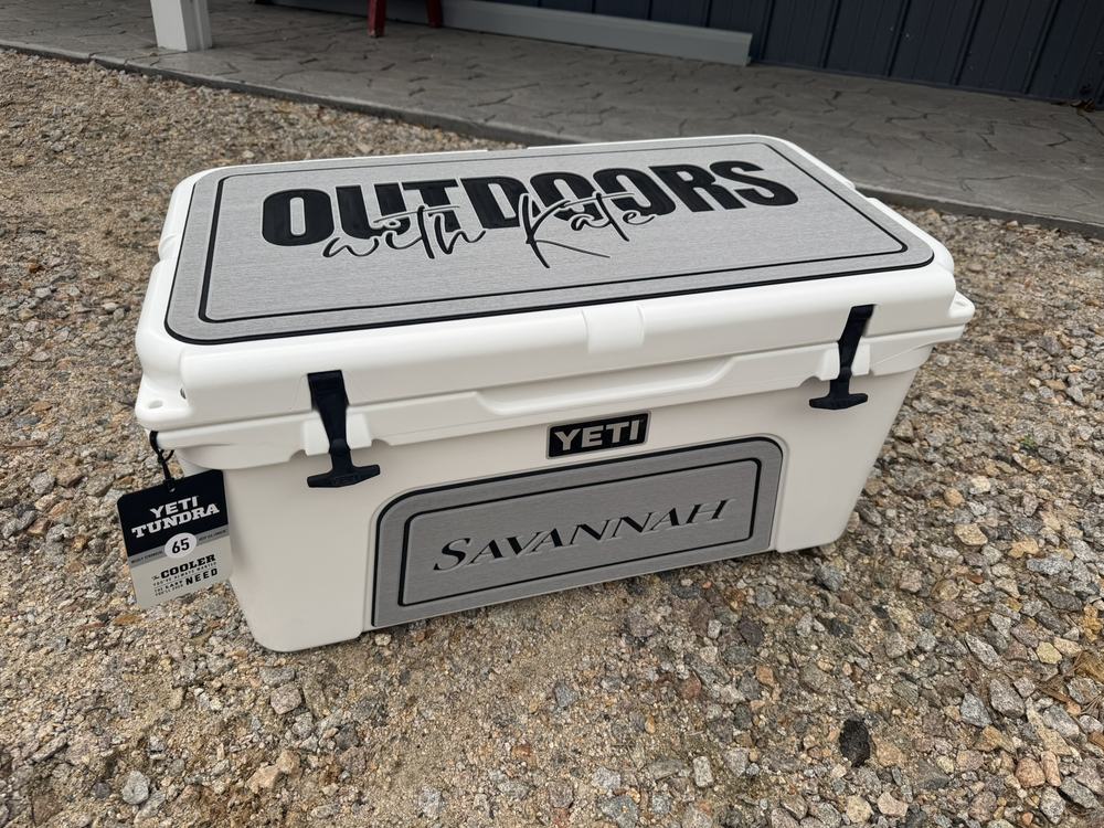 YETI Tundra 65 cooler with custom gray EVA foam lid and front pads cut with a logo and name