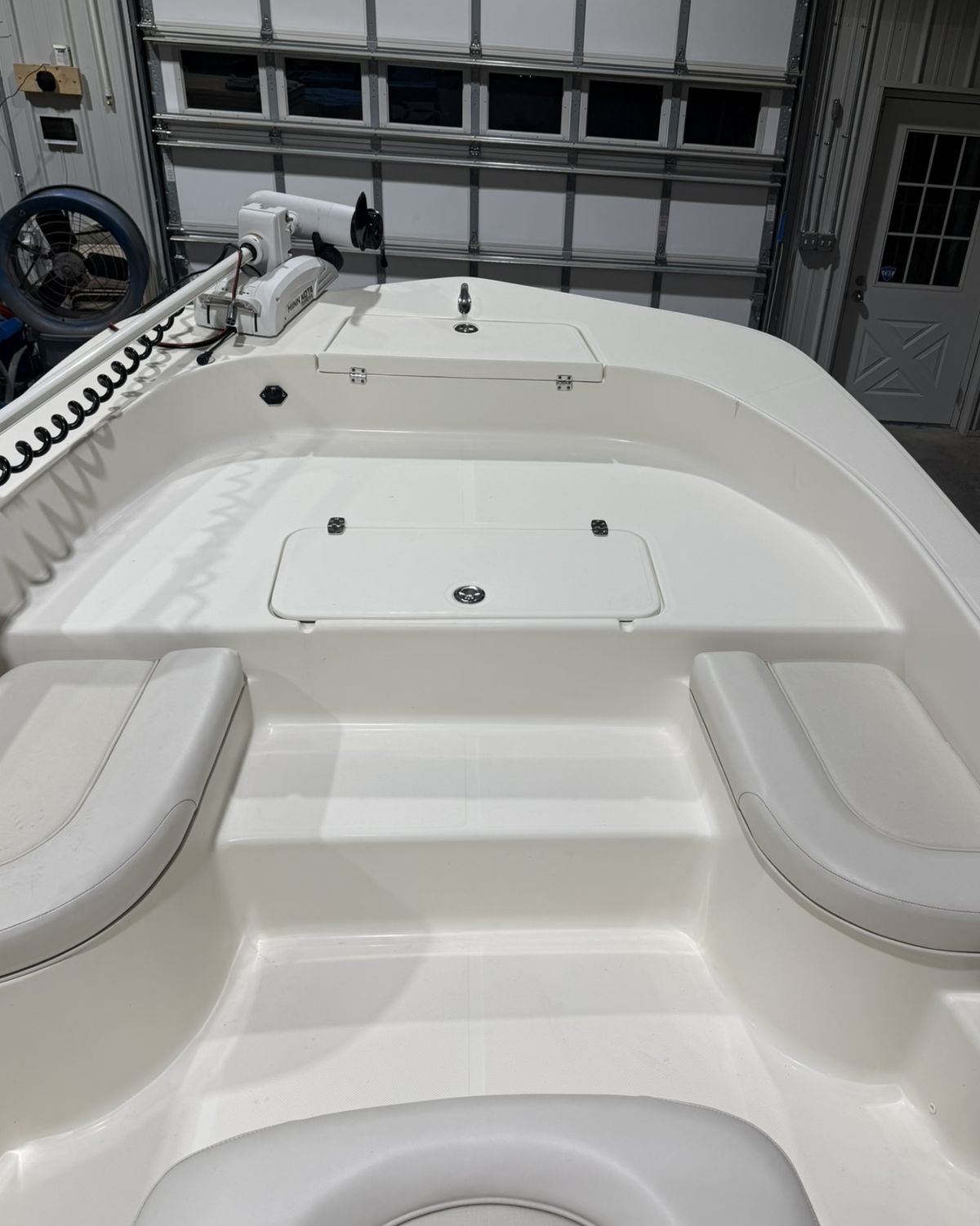 Bow of a Sundance bay boat with bare white gelcoat floor before foam decking