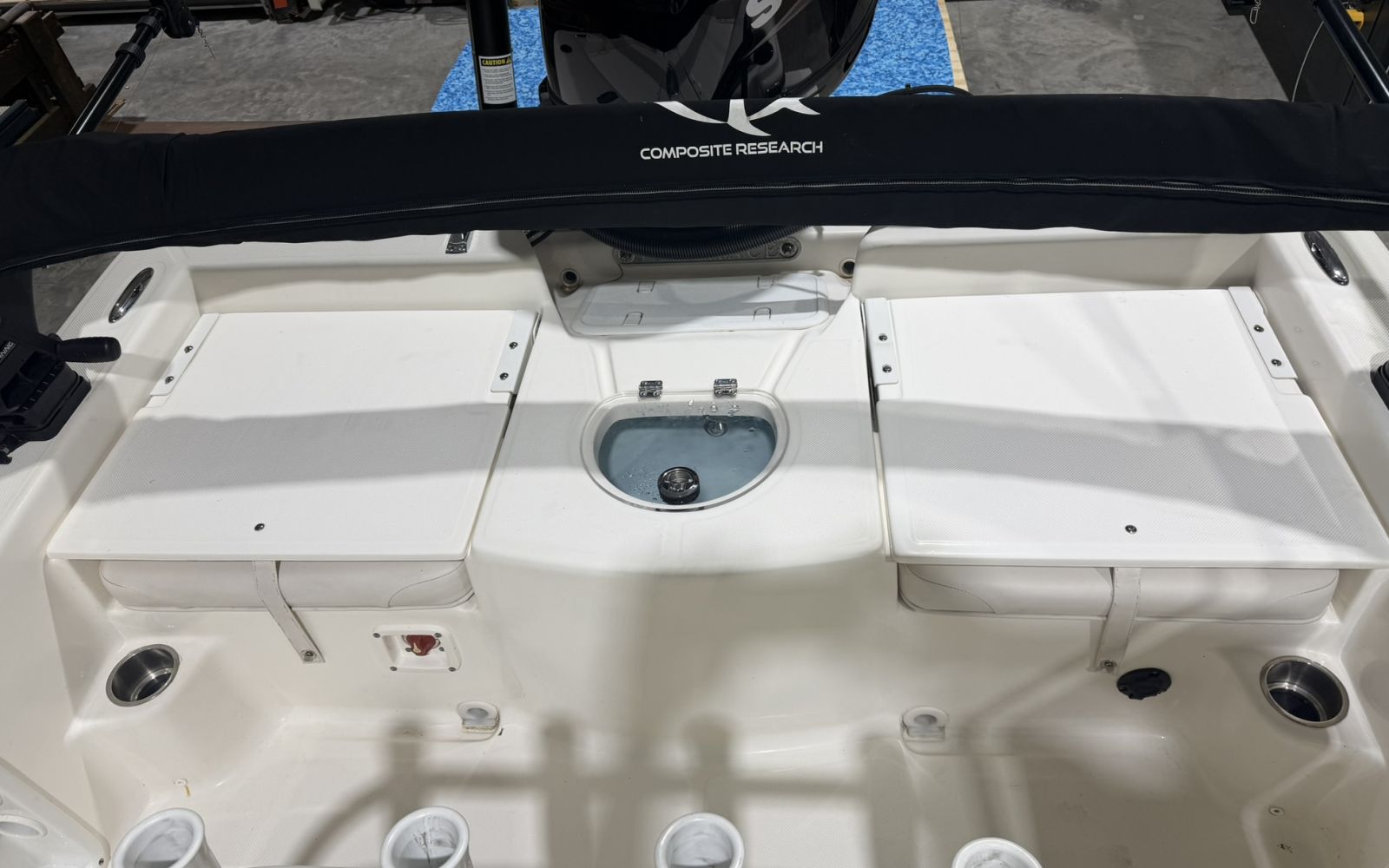 Stern hatches and livewell of a Sundance bay boat before foam decking